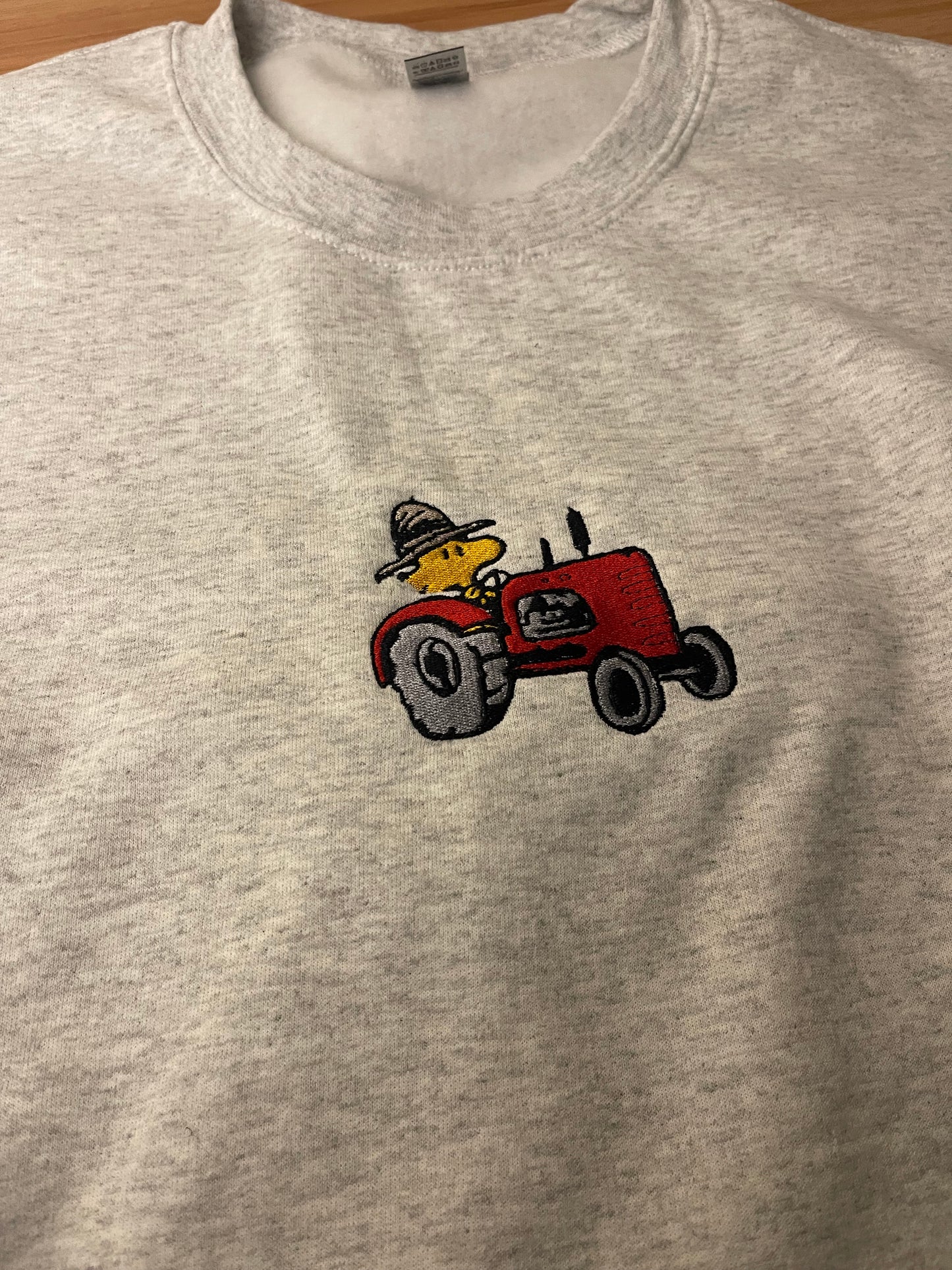 Woodstock on Tractor Embroidered Sweater