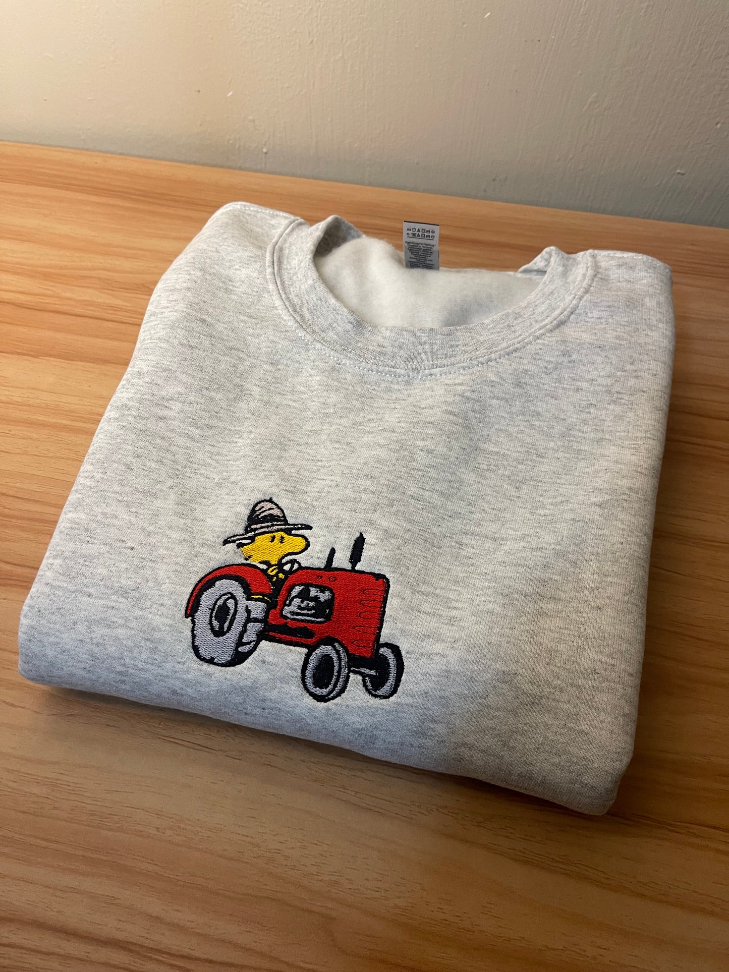 Woodstock on Tractor Embroidered Sweater