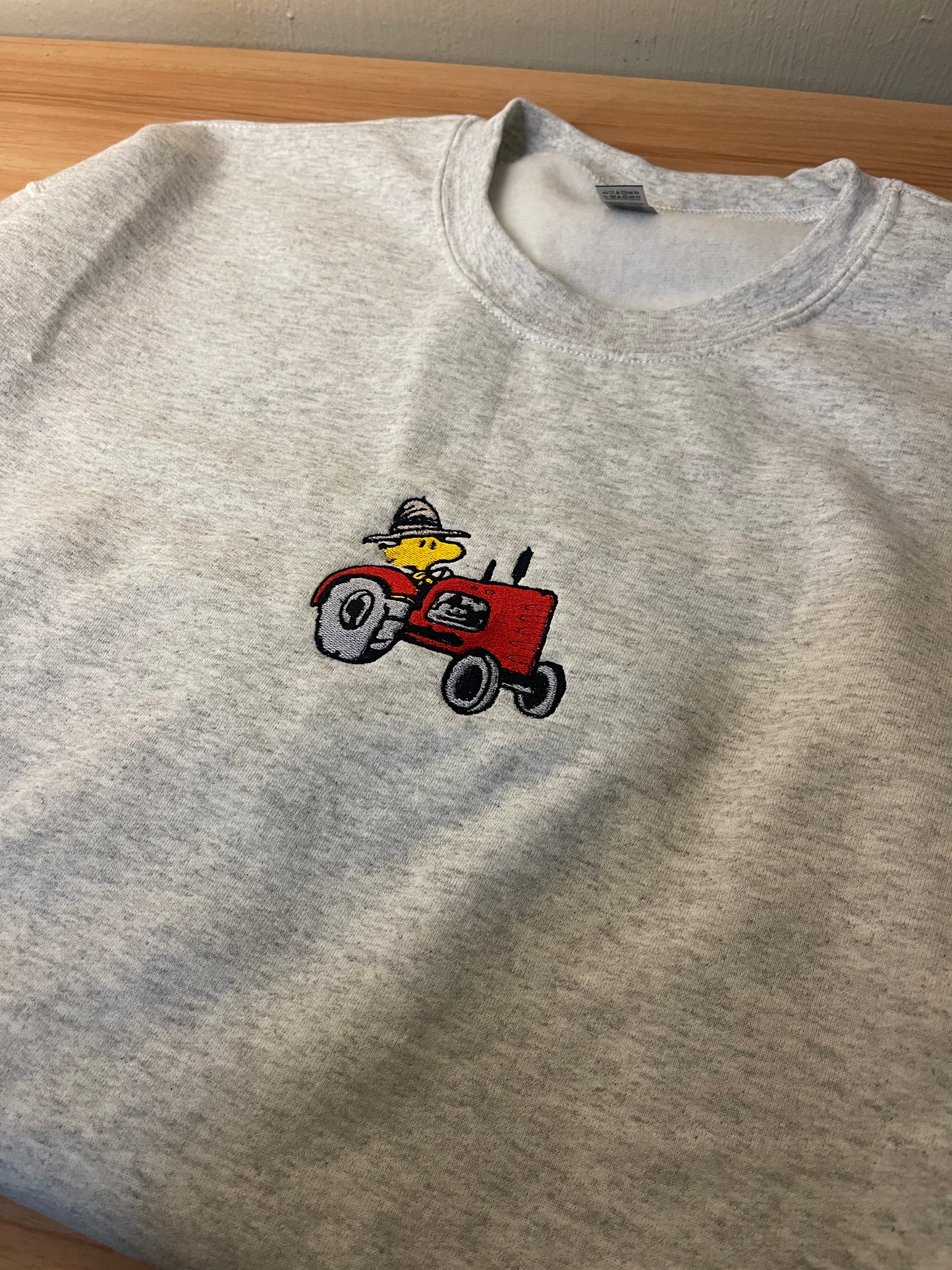 Woodstock on Tractor Embroidered Sweater